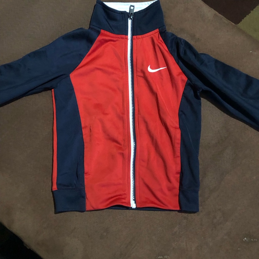 Red zip up Nike hoodie